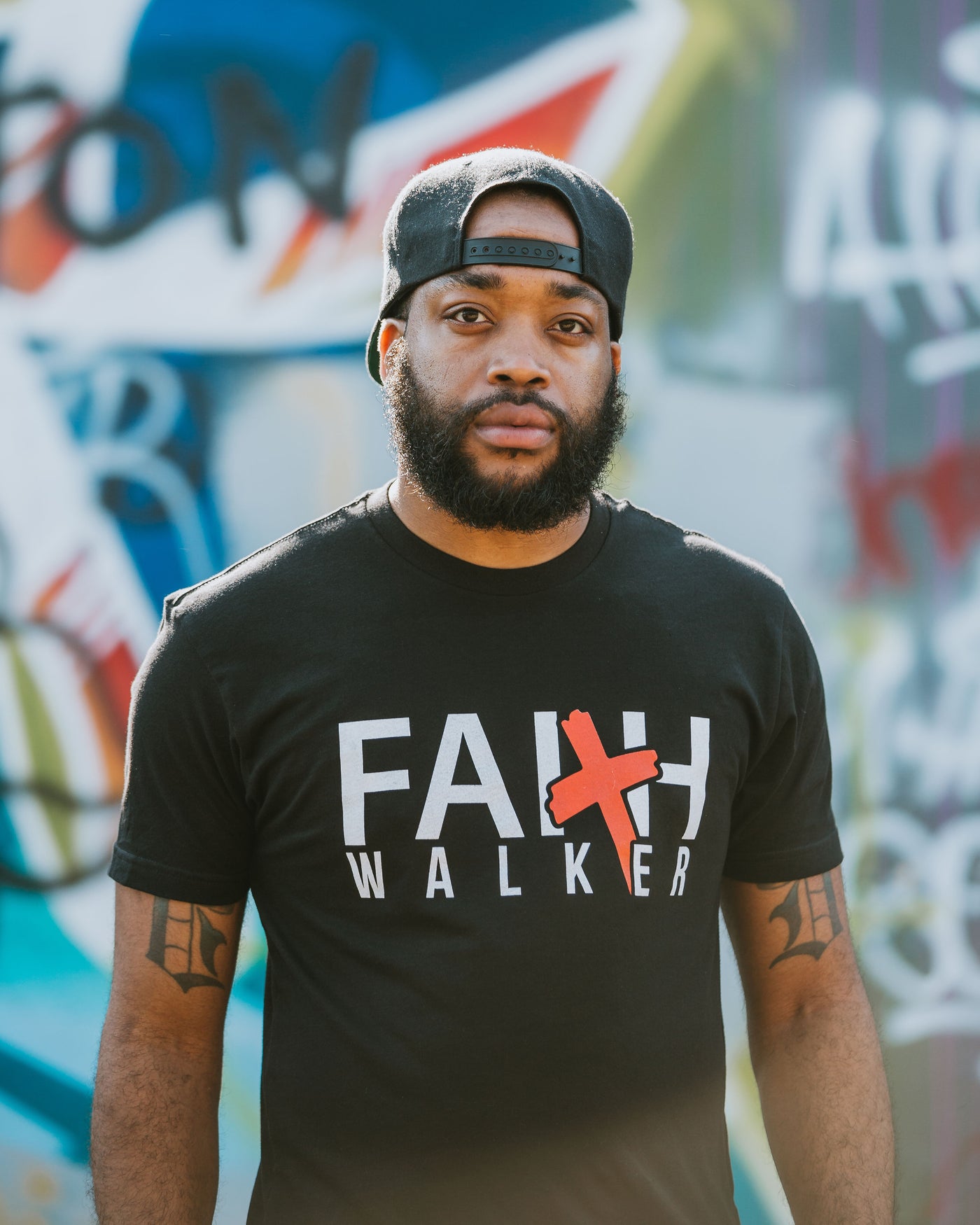2 Corinthians 5:7 For we Walk by FAITH and not by Sight. Faith Walker Tee is an outward statement of your FAITH in God. The red Cross represents the Blood Jesus shed on the cross for our sins. As you rep your FAITH remember all you need is FAITH the size of a mustard seed.
